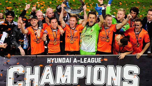 BRISBANE, AUSTRALIA - MAY 04: The Brisbane Roar celebrate after winning the 2014 A-League Grand Final match between the Brisbane Roar and the Western Sydney Wanderers at Suncorp Stadium on May 4, 2014 ...