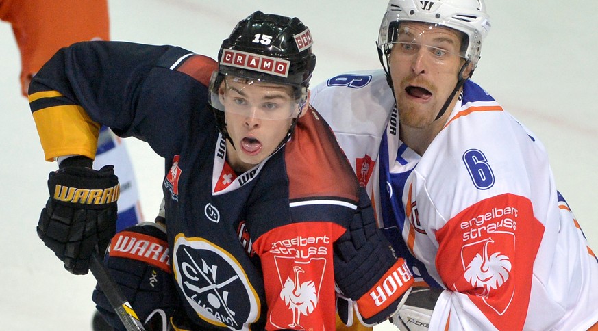 Lugano&#039;s player Gregory Hofmann, left, and Tappara &#039;s player Pekka Saravo, right, during the Champions Hockey League Group C hockey match between Switzerland&#039;s HC Lugano and Finland&#03 ...