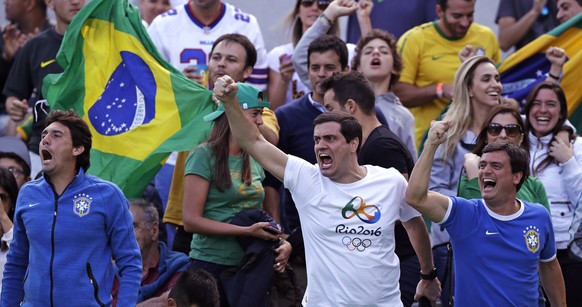 Fans cheer for Thomaz Bellucci, of Brazil, after he won a point against Rafael Nadal, of Spain, during their quarter final round match at the 2016 Summer Olympics in Rio de Janeiro, Brazil, Friday, Au ...