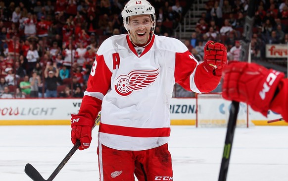 GLENDALE, AZ - FEBRUARY 07: Pavel Datsyuk #13 of the Detroit Red Wings celebrates with Tomas Tatar #21 after Tatar scored a third period goal against the Arizona Coyotes during the NHL game at Gila Ri ...