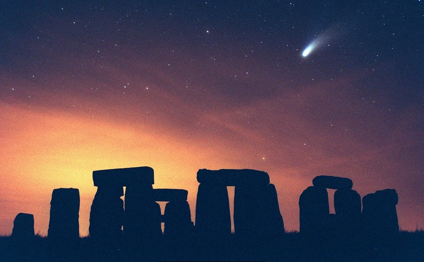 Comet Hale Bopp seen above the ancient stone circle of Stonehenge in south west England in this Friday March 28 1997 photo. Stonehenge the FA Cup and the Routemaster double-decker bus are are the icon ...