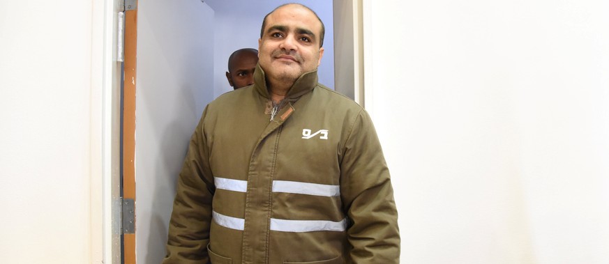 Palestinian Mohammad El Halabi (C), a manager of operations in the Gaza Strip for U.S.-based Christian charity World Vision, accused by Israel of funnelling millions of dollars in aid money to Hamas i ...
