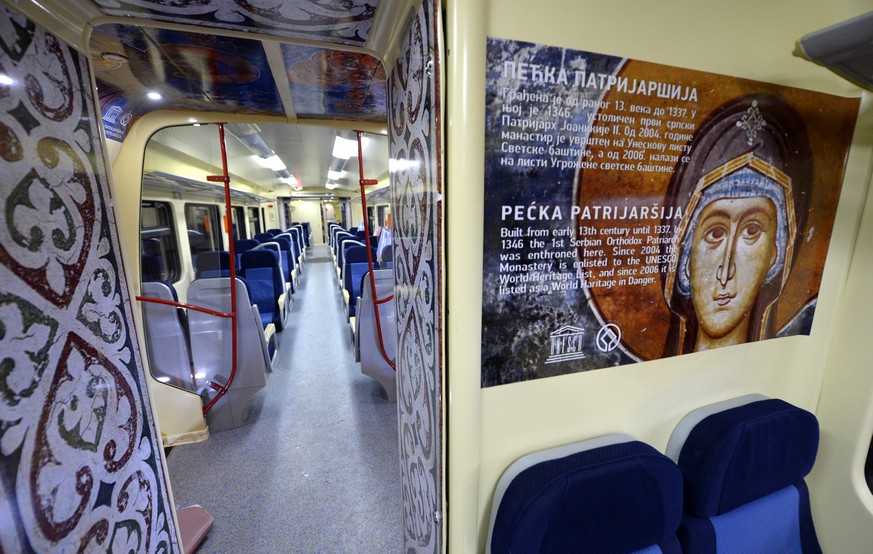 epa05718832 Interior view of a train that has been decorated with large images of Serbian Orthodox religious icons from famous monasteries in Kosovo, departing to Mitrovica, Kosovo, at the railway sta ...