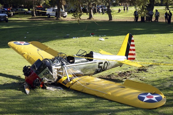 FILE - In this March 5, 2015 file photo, a World War II-era trainer airplane rests on the ground after actor Harrison Ford crash-landed it after reporting engine failure on the Penmar Golf Course in t ...