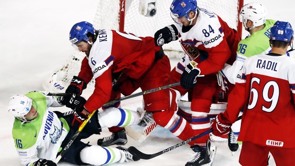 epa05959597 Michal Kempny (C) of Czech Republic bickers with Ales Music (L) of Slovenia during the IIHF Ice Hockey World Championship 2017 group B preliminary round game between Czech Republic and Slo ...