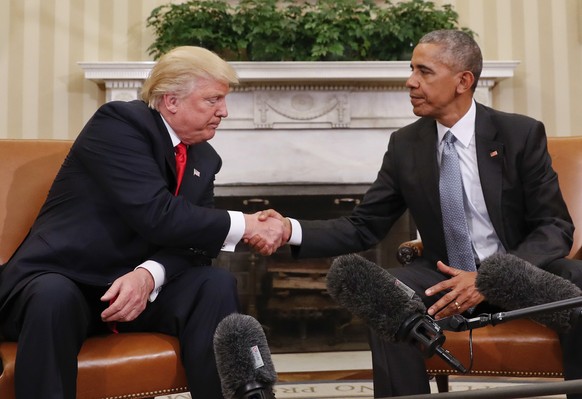 In this Nov. 10, 2016 photo, President Barack Obama and President-elect Donald Trump shake hands following their meeting in the Oval Office of the White House in Washington. (AP Photo/Pablo Martinez M ...