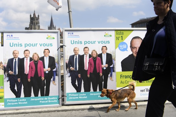 Des affiches du parti Les Liberaux-Radicaux, PLR, et de l&#039;Union Democratique du Centre, UDC, representant les 4 candidats pour le Conseil d&#039;Etat vaudois, Philippe Leuba, Jacqueline de Quattr ...