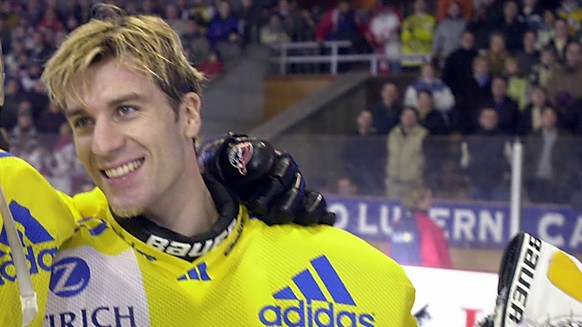 Lars Weibel, right, and Frederic Rothen, left, enjoy the victory: HC Davos won the Spengler Cup final against Canada Selects, Sunday, December 31, 2000, in Davos, Switzerland. It&#039;s the first time ...