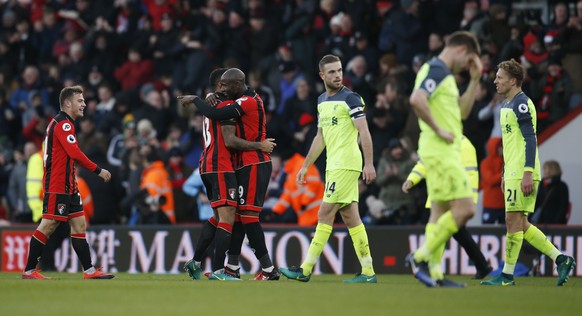 Britain Football Soccer - AFC Bournemouth v Liverpool - Premier League - Vitality Stadium - 4/12/16 Bournemouth&#039;s Benik Afobe celebrates with Callum Wilson and Ryan Fraser after the game as Liver ...
