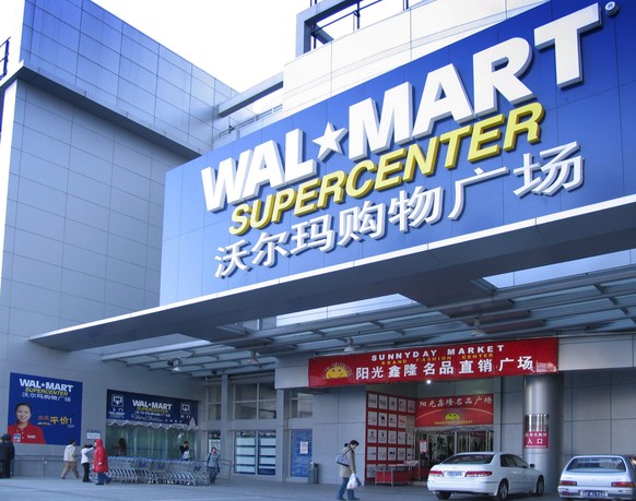 epa05380611 (FILE) A file picture dated 28 November 2005 shows the first branch of the US retail giant Walmart in Beijing, China. According to media reports on 21 June 2016, Walmart announced its part ...