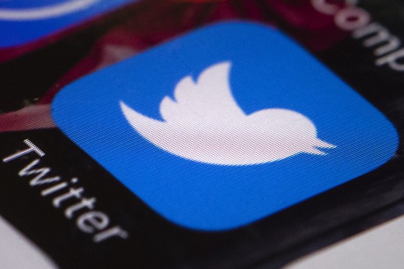 FILE- This April 26, 2017, file photo shows the Twitter app on a mobile phone in Philadelphia. Twitter is testing a 280-character limit, doubling the current length restriction that’s been in place si ...