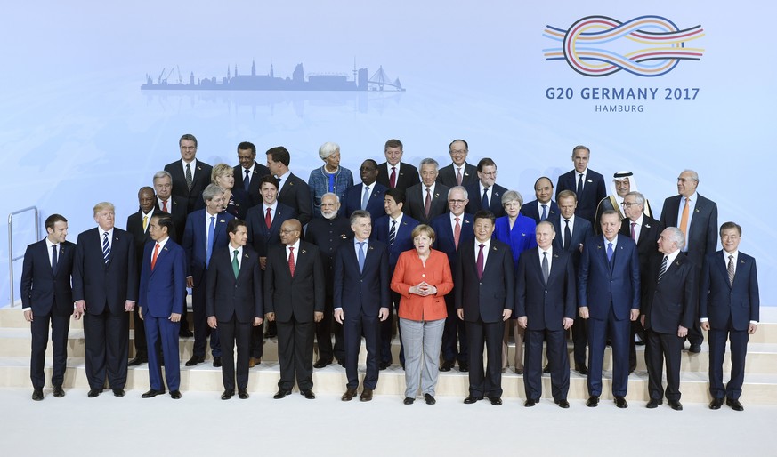 epa06072746 Heads of state and government of G20 members pose for a family photo at the opening day of the G20 summit in Hamburg, Germany, 07 July 2017. The G20 Summit (or G-20 or Group of Twenty) is  ...