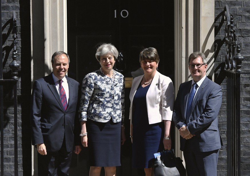 Britain&#039;s Prime Minister Theresa May, second left, greets Democratic Unionist Party (DUP) leader Arlene Foster, second right, DUP deputy leader Nigel Dodds, left, and member of parliament Jeffrey ...