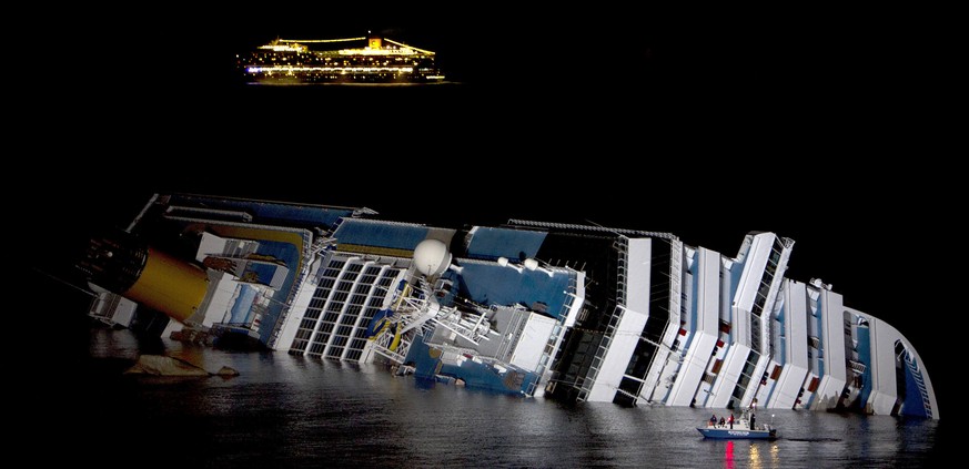 The cruise ship Costa Serena sails as its sister ship Costa Concordia cruise ship lays on its side after it ran aground off the west coast of Italy at Giglio island in this January 18, 2012 file photo ...