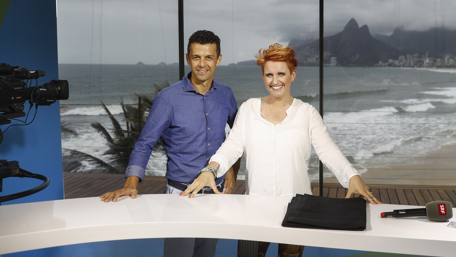 Swiss sport moderators Jann Billeter, left, and Steffi Buchli, right, are pictured during a media tour in the SRG TV-Studio at Ipanema beach, in Rio de Janeiro, Brazil, prior to the Rio 2016 Olympic S ...