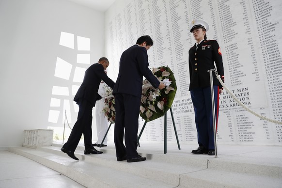 President Barack Obama and Japanese Prime Minister Shinzo Abe participate in a wreath laying ceremony at the USS Arizona Memorial, part of the World War II Valor in the Pacific National Monument, in J ...