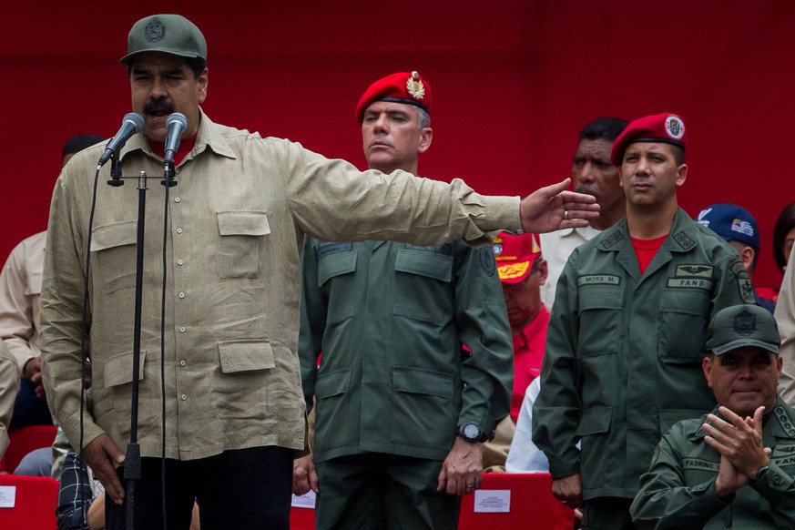 epa05912837 Venezuelan President, Nicolas Maduro (L), attends a march of members of the Venezuelan National Bolivarian Militia to commemorate their seventh anniversary in Caracas, Venezuela, 17 April  ...