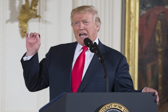 epa06119221 US President Donald J. Trump delivers remarks before awarding the Medal of Honor to former US Army medic and Vietnam War veteran James McCloughan (not pictured), during a ceremony in the E ...