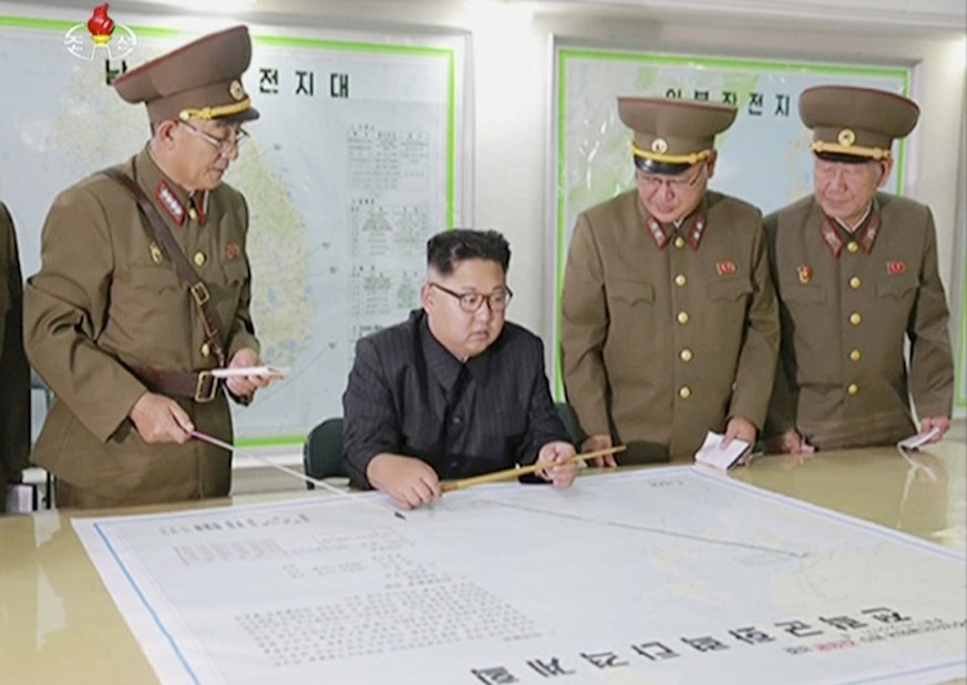 FILE - In this file image made from video of an Aug. 14, 2017, broadcast in a news bulletin by North Korea&#039;s KRT, North Korean leader Kim Jong Un receives a military briefing in Pyongyang. Conven ...
