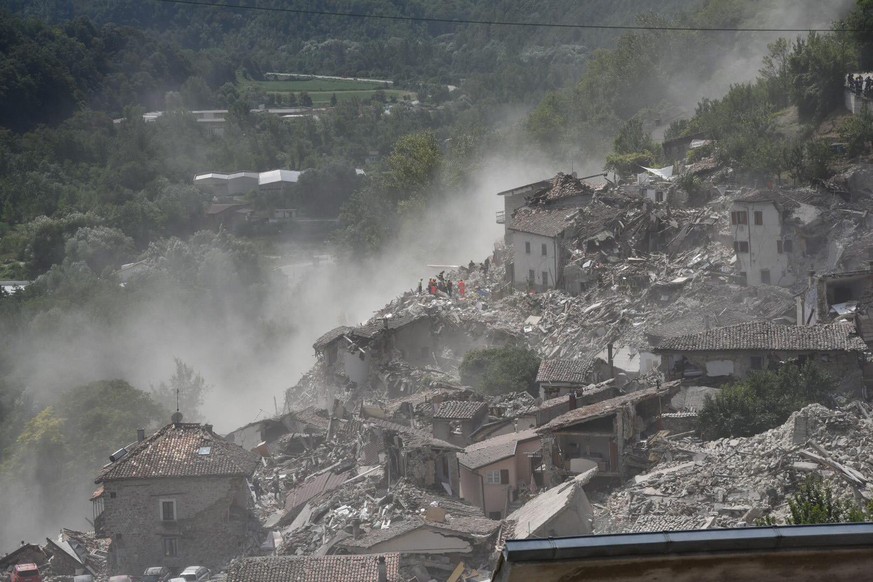 epa05508647 A view of collapsed and damaged houses after the earthquake in Arquata del Tronto, central Italy, 24 August 2016, following a 6.2 magnitude earthquake, according to the United States Geolo ...