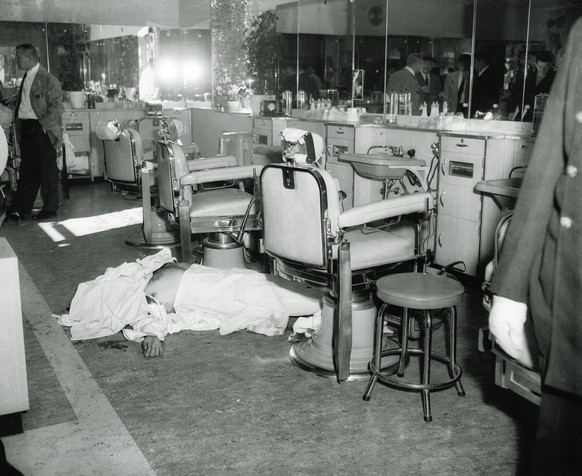 The body of Mafia boss Albert Anastasia lies on the floor of the barbershop at New York&#039;s Park Sheraton Hotel after his murder, in this October 1957, file photo. Anastasia was a friend of fellow  ...