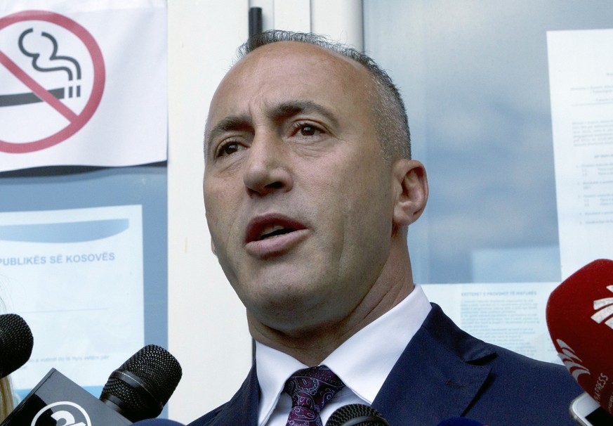 FILE - In this file photo dated Sunday, June 11, 2017, Ramush Haradinaj, candidate for Prime Minister, speaks to media reporters after casting his ballot during the early parliamentary elections Prist ...