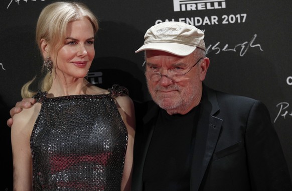 Photographer Peter Lindbergh and Nicole Kidman pose during a photocall to unveil the Pirelli 2017 calendar by Peter Lindbergh in Paris, Tuesday, Nov. 29, 2016. (AP Photo/Christophe Ena)