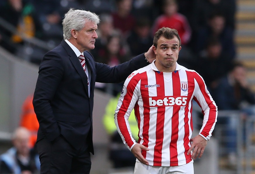 Britain Soccer Football - Hull City v Stoke City - Premier League - The Kingston Communications Stadium - 22/10/16
Stoke City manager Mark Hughes with Stoke City&#039;s Xherdan Shaqiri 
Reuters / Sc ...