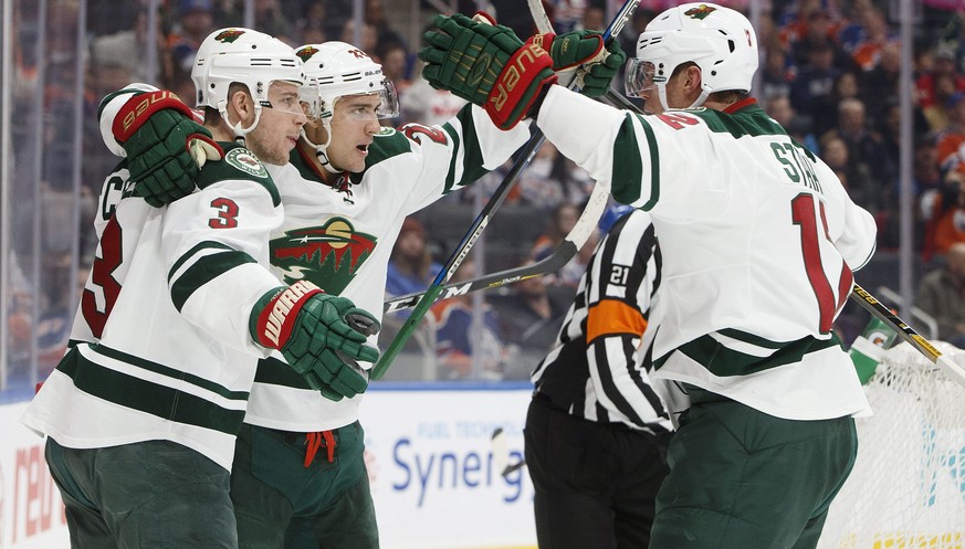 Minnesota Wild&#039;s Charlie Coyle (3), Nino Niederreiter (22) and Eric Staal (12) celebrate a goal against the Edmonton Oilers during the first period of an NHL hockey game in Edmonton, Alberta, Sun ...