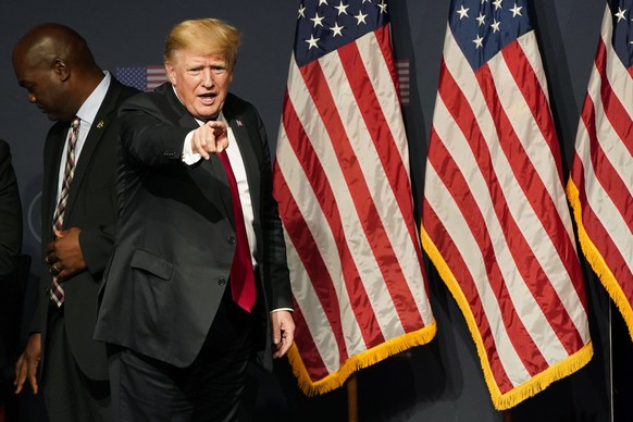 Former President Donald Trump motions after speaking at an event with Joe Lombardo, Clark County sheriff and Republican candidate for Nevada governor, and Republican Nevada Senate candidate Adam Laxal ...