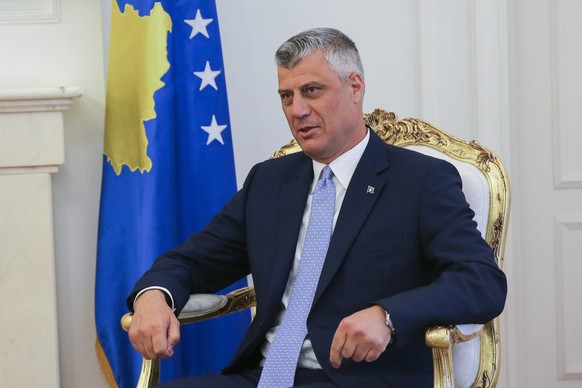 epa05247614 Newly elected Kosovo President Hashim Thaci sits at the president&#039;s office after he was received by the outgoing President of the Republic of Kosovo, Atifete Jahjaga (unseen), in Pris ...