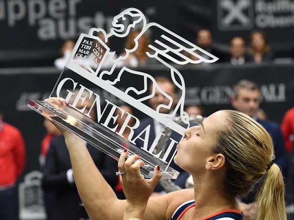 Slovakia&#039;s winner Dominika Cibulkova kisses her trophy after her final match against Switzerlands Viktorija Golubic at the Generali Ladies tennis tournament in Linz, Austria, Sunday, Oct. 16, 20 ...