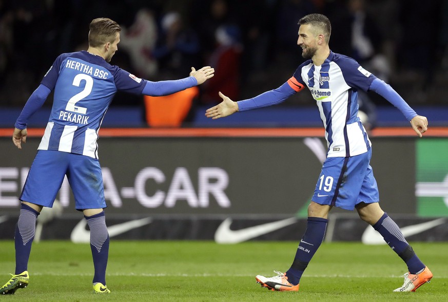 Hertha Berlin&#039;s scorer Vedad Ibisevic, right, and his teammate Peter Pekarik, left, celebrate their side&#039;s second goal during the German Bundesliga soccer match between Hertha BSC Berlin and ...