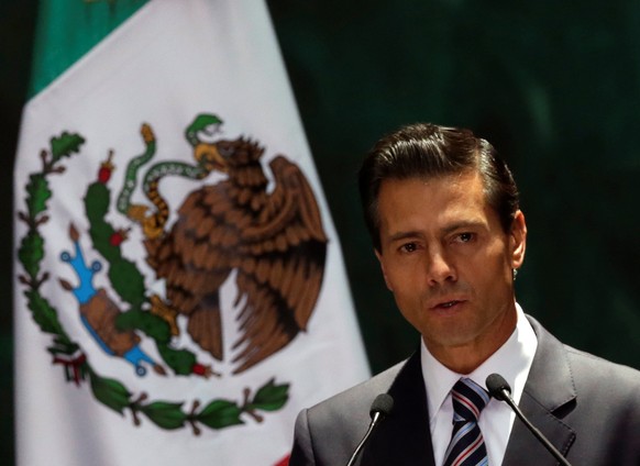 Mexico&#039;s President Enrique Pena Nieto gives a speech next to Paraguay&#039;s President Horacio Manuel Cartes Jara (not pictured) during an official welcoming ceremony, at the National Palace in M ...