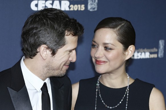 epa04630743 A picture made available on 21 February 2015 shows French actor-director Guillaume Canet (L) and French actress Marion Cotillard (R) arriving for the 40th annual Cesar awards ceremony held ...