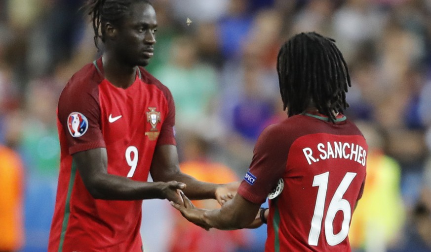 Portugal&#039;s Eder, left, replaces Renato Sanches during the Euro 2016 final soccer match between Portugal and France at the Stade de France in Saint-Denis, north of Paris, Sunday, July 10, 2016. (A ...
