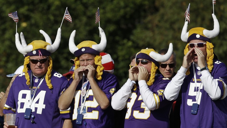 NFL Minnesota Vikings fans watch the fourball match on the 12th green on the second day of the Ryder Cup golf tournament, at Gleneagles, Scotland, Saturday, Sept. 27, 2014. (AP Photo/Matt Dunham)