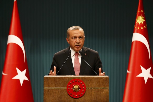 Turkish President Tayyip Erdogan speaks during a news conference following the National Security Council and cabinet meetings at the Presidential Palace in Ankara, Turkey, July 20, 2016. REUTERS/Umit  ...