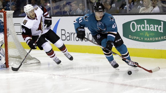 San Jose Sharks&#039; Mirco Mueller (41) is chased by Arizona Coyotes&#039; Joe Vitale (14) during the second period of an NHL preseason hockey game Friday, Sept. 25, 2015, in San Jose, Calif. (AP Pho ...