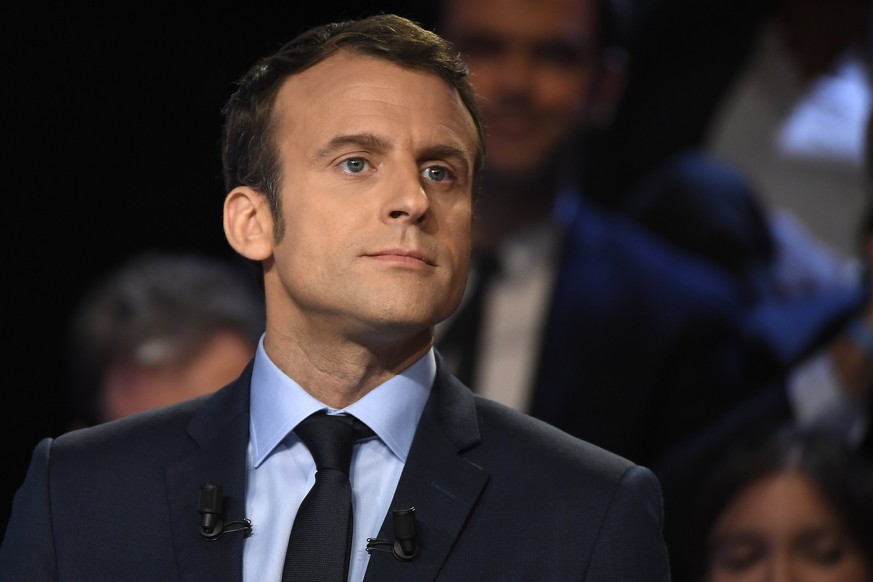 epa05888842 French presidential election candidate for the En Marche! (Forward!) movement Emmanuel Macron attends a debate organized by French private TV channels BFM TV and CNews, between the eleven  ...