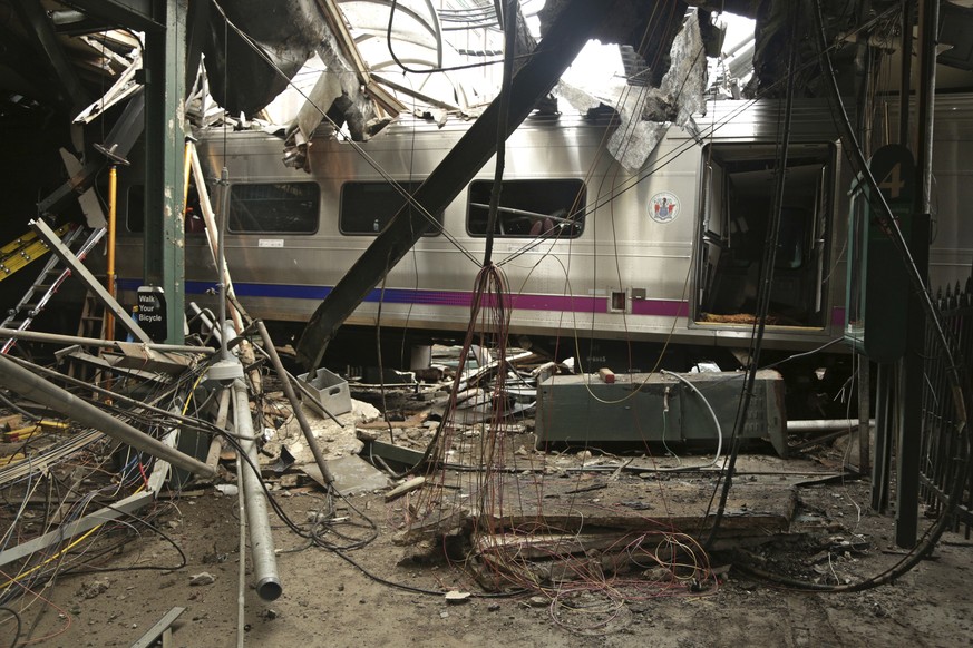 FILE - This Oct. 1, 2016, file photo, provided by the National Transportation Safety Board shows damage done to the Hoboken Terminal in Hoboken, N.J., after a commuter train crash. New Jersey Transit  ...