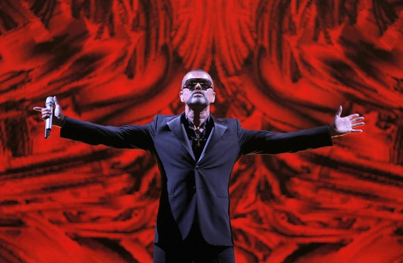 FILE - In this Sept. 9, 2012 file photo, British singer George Michael performs at a concert to raise money for the AIDS charity Sidaction, during the Symphonica tour at Palais Garnier Opera house in  ...