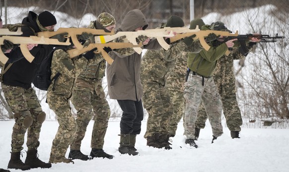 Local residents train close to Kyiv, Ukraine, Sunday, Jan. 30, 2022. Russia&#039;s foreign minister claims that NATO wants to pull Ukraine into the alliance, amid escalating tensions over NATO expansi ...