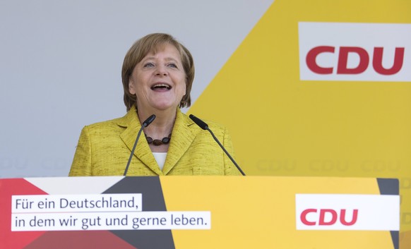 epa06088890 German Chancellor Angela Merkel speaks during her summer tour on the open-air stage at the casino (Freilichtbuehne am Kurhaus) in Zingst, Germany, 15 July 2017. Merkel traveled through nor ...
