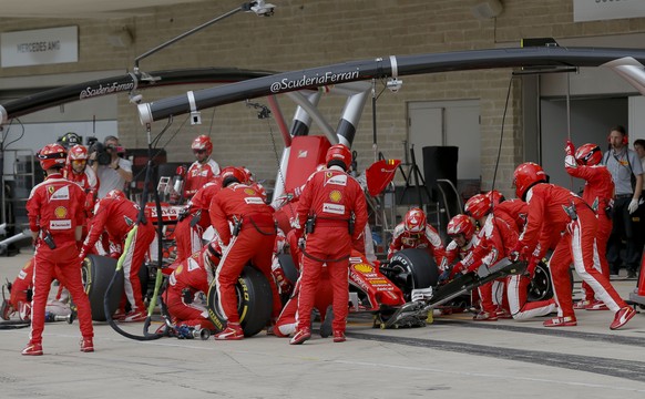 Ferrari driver Sebastian Vettel, of Germany, stops in the pits during the Formula One U.S. Grand Prix auto race at the Circuit of the Americas, Sunday, Oct. 23, 2016, in Austin, Texas. (AP Photo/Tony  ...