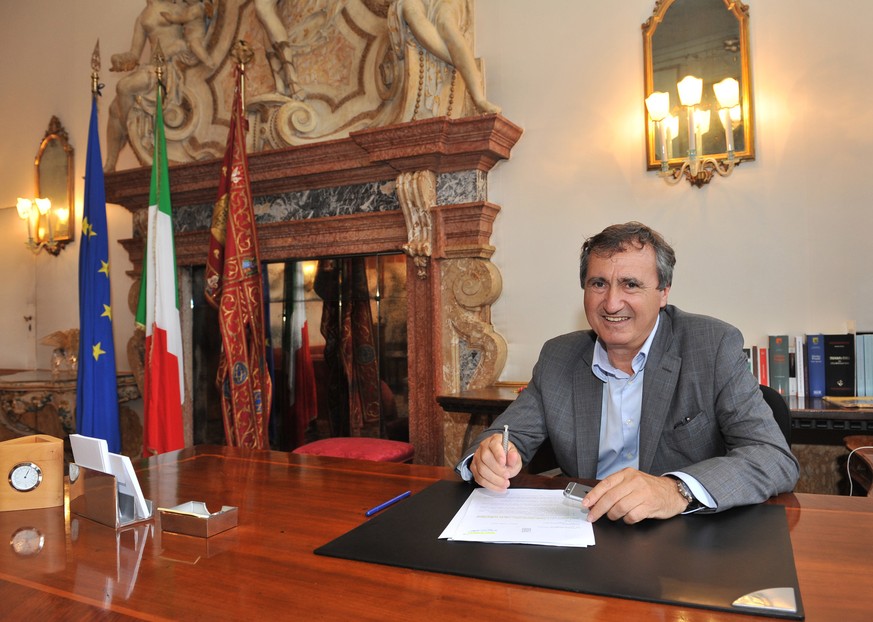 In this picture taken on June 16, 2015 and made available on Tuesday, Aug. 18, 2015, Venice mayor Luigi Brugnaro poses for the photographer in his office, in Venice. Elton John has slammed the Venice  ...