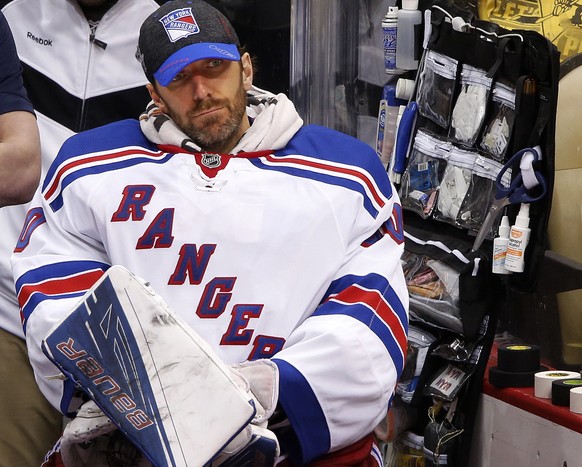 New York Rangers goalie Henrik Lundqvist sits on the bench during the third period after being pulled during game 5 in a first-round NHL playoff hockey game against the Pittsburgh Penguins in Pittsbur ...