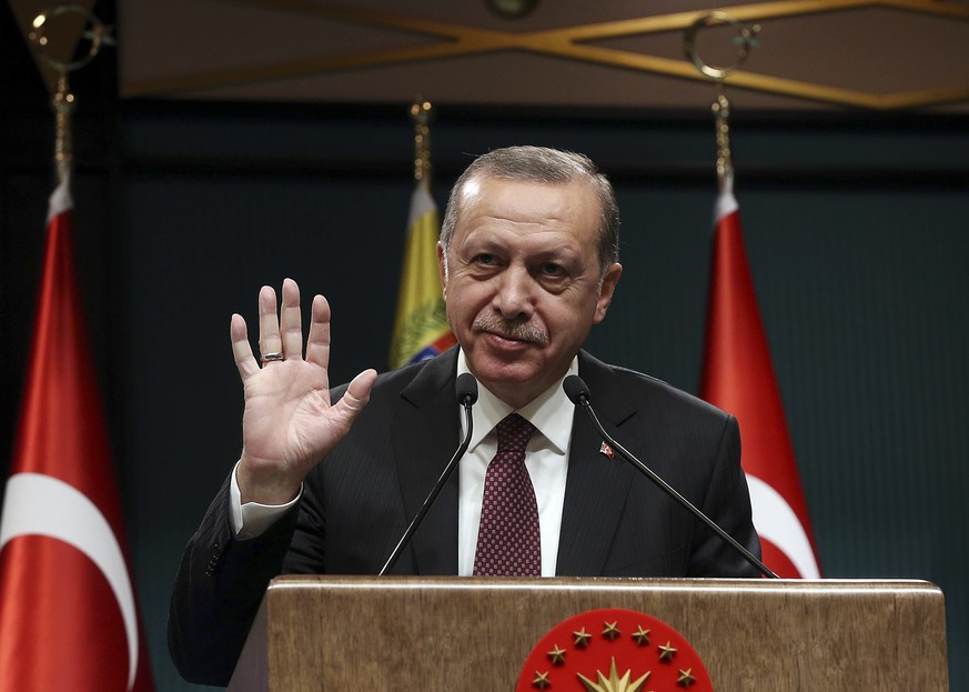 Turkey&#039;s President Recep Tayyip Erdogan gestures during a joint media statement with Venezuela&#039;s President Nicolas Maduro, following their meeting at the Presidential Palace in Ankara, Turke ...