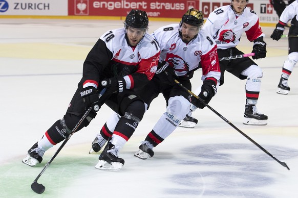 Player of HC Fribourg-Gotteron Marc-Antoine Pouliot, left, in action against player of HC Orli Znojmo Sean McMonagle, right, during the Champions Hockey League Group F hockey match between Switzerland ...