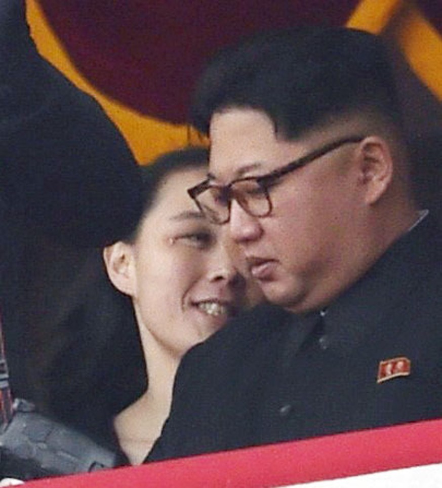 In this May 10, 2016, photo, North Korean leader Kim Jong Un, right, and his sister Kim Yo Jong watch a military parade at Kim Il Sung Square in Pyongyang. Kim Jong Un has promoted his younger sister  ...
